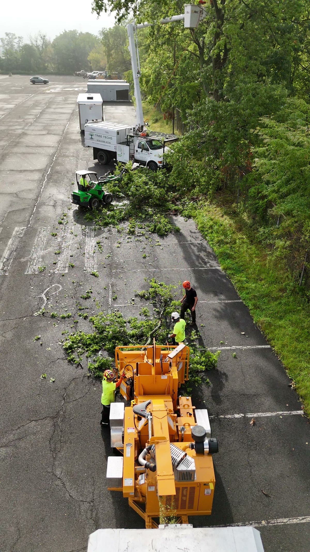 Overhead view of loader moving debris toward the chipper